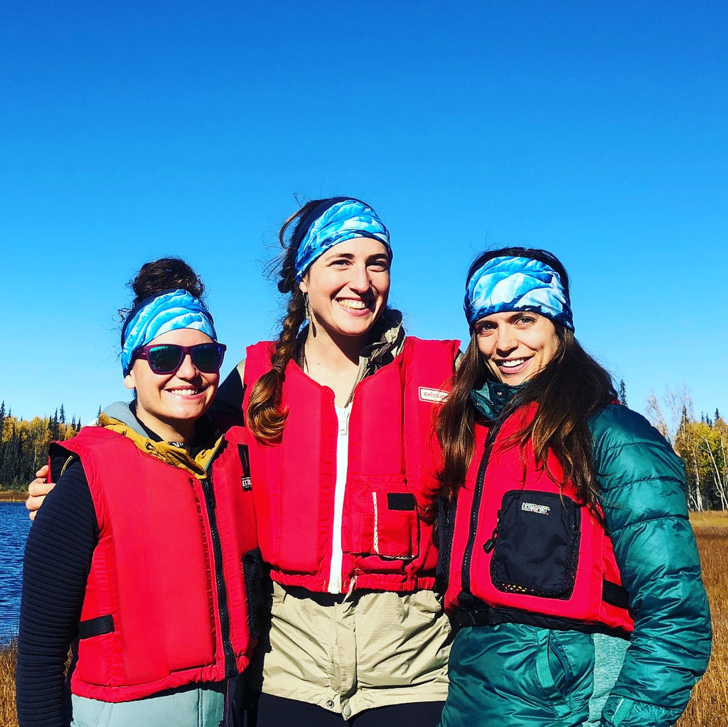Sarah, Rosalind, and Katrina wearning Turnagain Pass skiing map buff